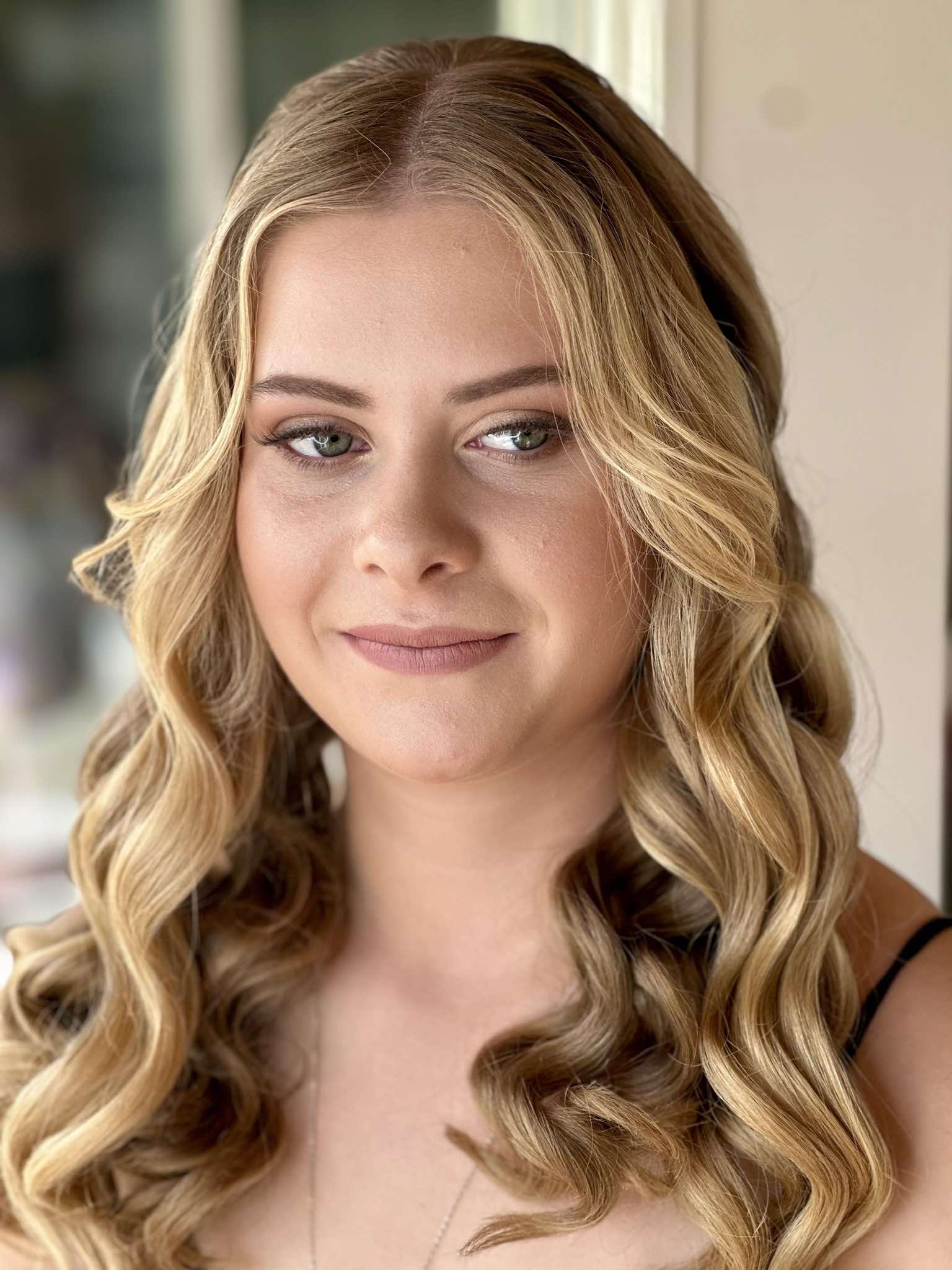 A diverse range of models of different ages showcasing beautiful, naturally glowing makeup. The models, including young adults, middle-aged individuals, and sen