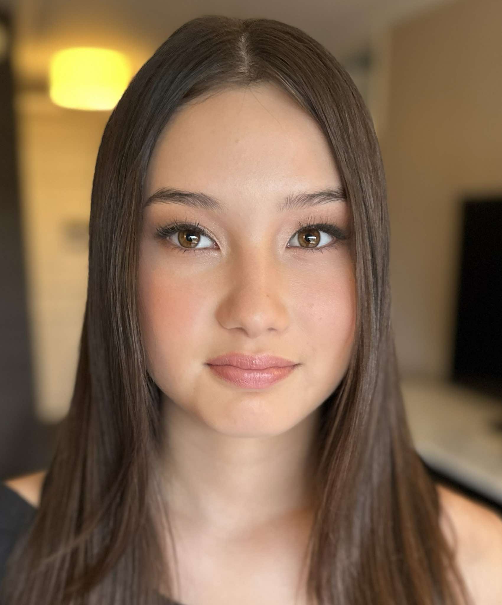 A diverse range of models of different ages showcasing beautiful, naturally glowing makeup. The models, including young adults, middle-aged individuals, and sen