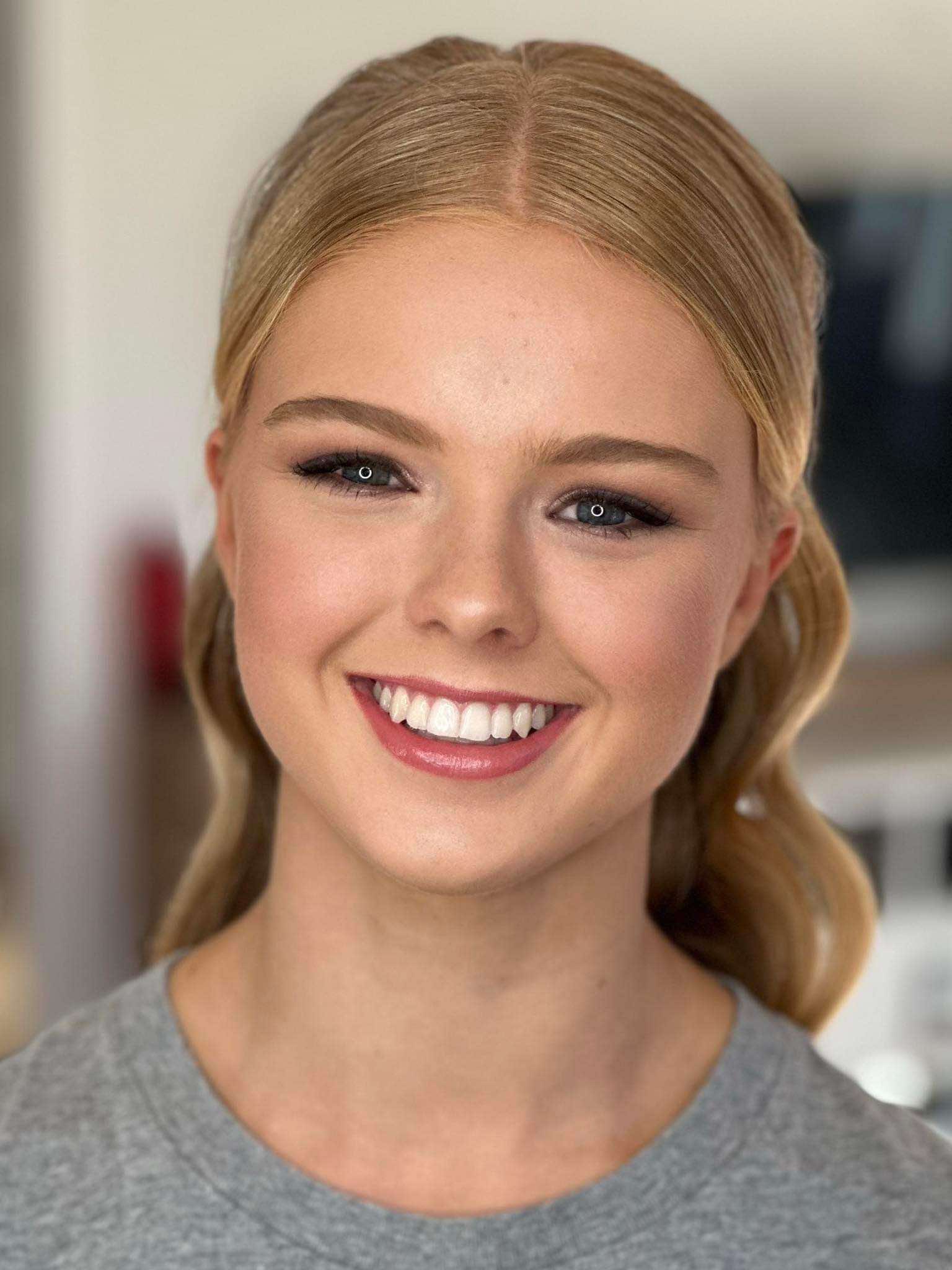 A diverse range of models of different ages showcasing beautiful, naturally glowing makeup. The models, including young adults, middle-aged individuals, and sen